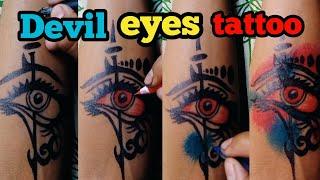 Devil eyes tattoo at home