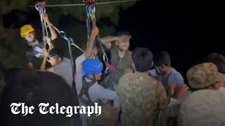 Pakistan: Moment final children are rescued from suspended cable car