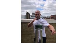 Jason Statham removes a bottle cap