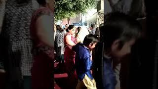 Mom beating her kid at a party 