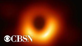 Astronomers capture black hole and its shadow for first time