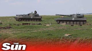 Russian tanks advance in Yasynuvata city in Ukraine's Donetsk region