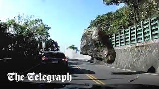 Moment boulder strikes car during Taiwan earthquake