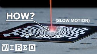 How Do Laser Beams Engrave Things? (slow motion) | WIRED