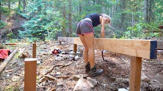 Just a girl, building her fort in the woods.