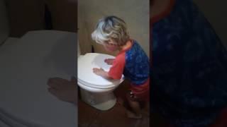 Boy Drumming on Toilet