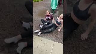 Two Women Speed Down Slide Together and Fall Hard on Their Butts - 1233298