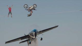 Motorcycle Backflips Over Airplane In INSANE Stunt