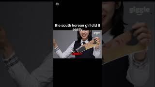 South & north korean girl tearing kim-jung-un's pic