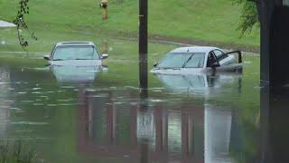 Cars submerged in water after flash flooding in Louisville