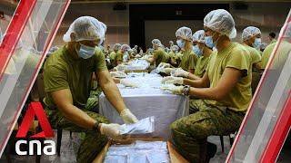 Wuhan coronavirus: SAF personnel pack masks for distribution to Singapore households