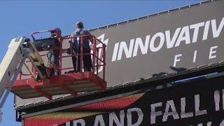 Innovative Field signs being put up at Frontier Field