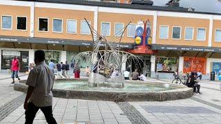 Stockholm Walks: Rinkeby. Suburb center in summer.