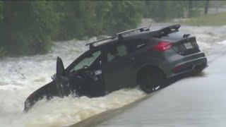 Emergency crews performing high-water rescues during flooding in Houston area