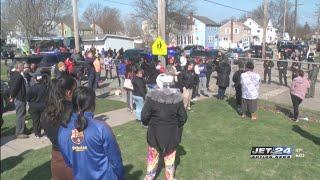 Erie High School students pick up belongings after shooting