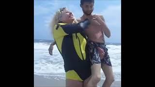 strong woman lift man with one hand