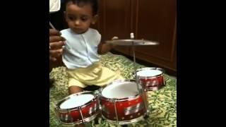 Bryan Adithya (12 months) playing drums