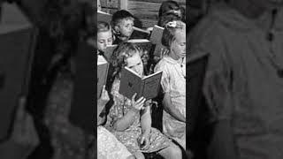 Children reading books at School in 1940