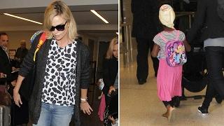 Charlize Theron Catches Flight As Son Jackson Dons Pink Skirt