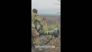 Ukraine war, Ukrainian soldier firing a Javelin missile against a Russian tank, destroying it