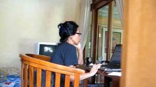 Tante Dewi H working at the Villa, Bali