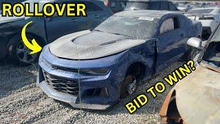 BIDDING TO WIN ON A  ROLLOVER CAMARO ZL1 !