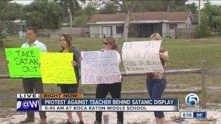 Protest for and against teacher who put up Satanic display