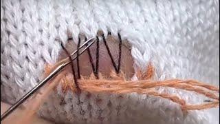 Repairing a hole in a sweater using a needle using the original method