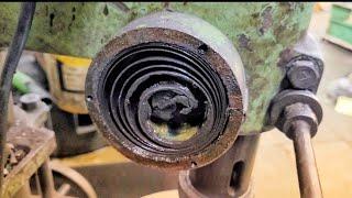 how to change broken spring of bench drill machine ?