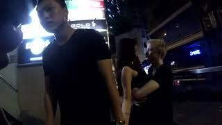 White man kissing asian man's girlfriend
