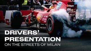 Lewis and Charles driving TOGETHER on the streets of Milan