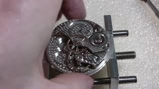 Making pocket watch run better, Bunn, Illinois Watch Co.