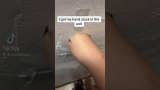 My hand got stuck in the wall