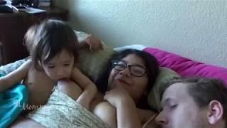 Breastfeeding with husband playing