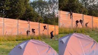 Shocking moment people scale fence to sneak into Glastonbury festival