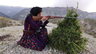 The woman shepherds the children in the mountainous area of the nomadic village