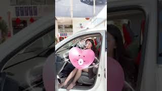 Chinese girl show her black nylon feet in car