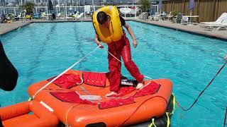 Flipping a 6 person upside down life raft