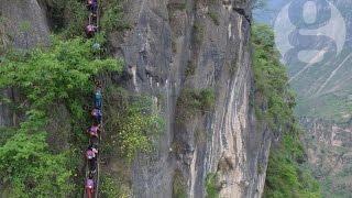 Chinese children climb 800m cliff to get home from school