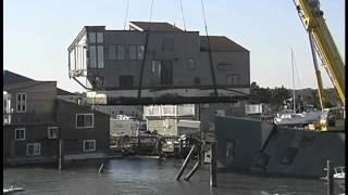 Deep water salvage. Sea Village Marina, Lifting floating home from the water after Hurricane Sandy.