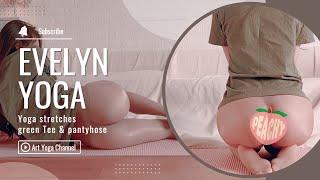 Yoga stretches in green Tee &  pantyhose | Evelyn Yoga 