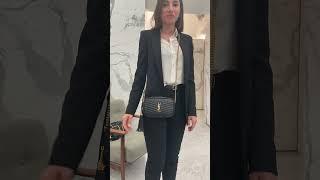 Modeling ysl purse in ysl florence, italy