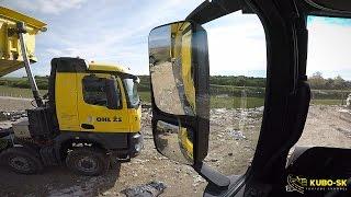 Mercedes Benz Arocs 4448 transport clay on landfill - truck cab view