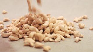 Cashews Nuts Falling Down on a Linen Fabric (Stock Footage)