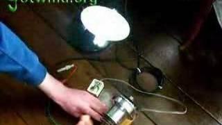 Free energy - Dynohub Powering a 12v fluorescent lamp CFL