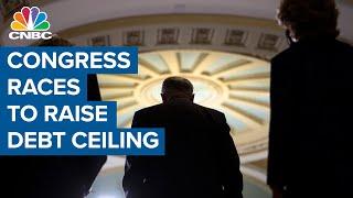 Congress races to raise debt ceiling, avert government shutdown
