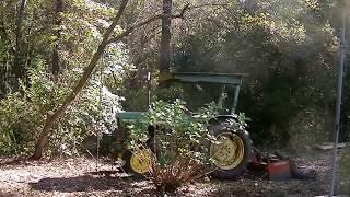 Tractor vs stumps.Pulling up trees, roots and all, in reverse? Rope trick.