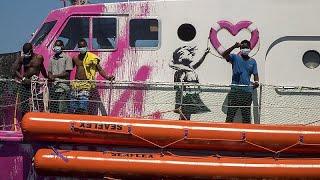 Migrants moved off Banksy-funded rescue ship now seek port to dock