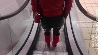 DANA LABO - the woman in red, walk in shiny leggings, red boots and leather jacket