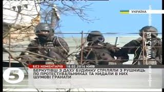 Euromaidan - Riot cops throw grenades and shoot at protesters from roof in Kiev Ukraine